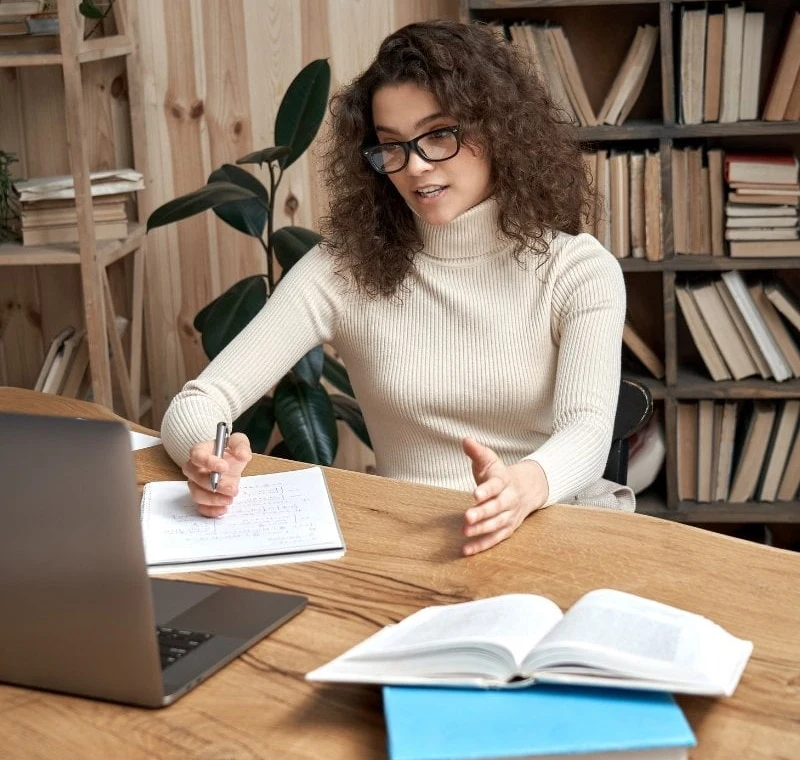 Erudite Tuition tutor completing an application on a laptop.